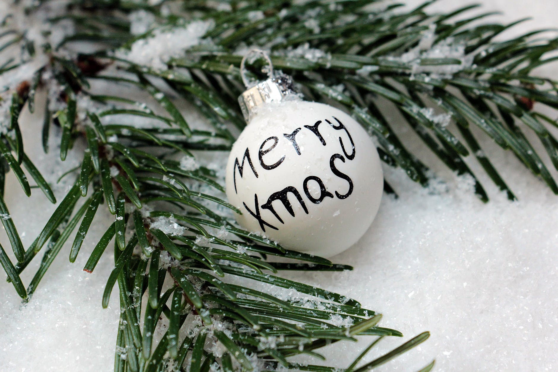 white bauble on christmas tree