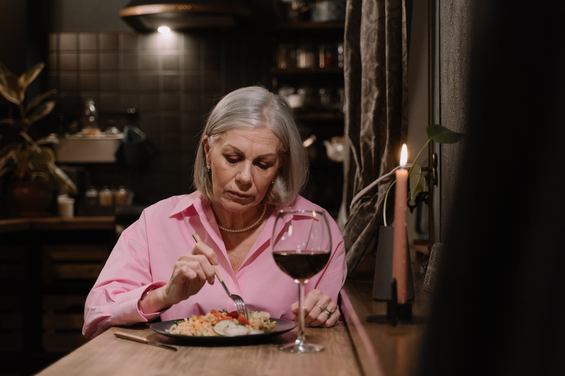 a woman eating alone