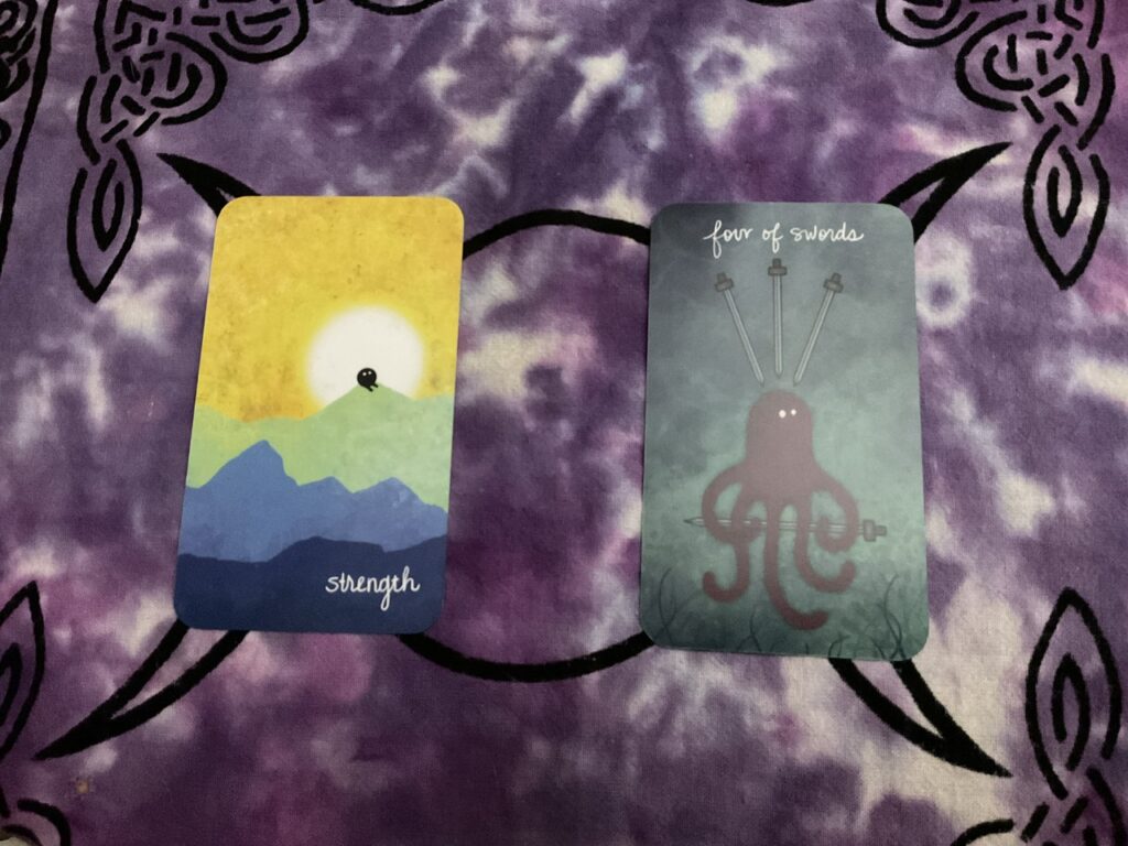 Creatures tarot strength and four of swords cards