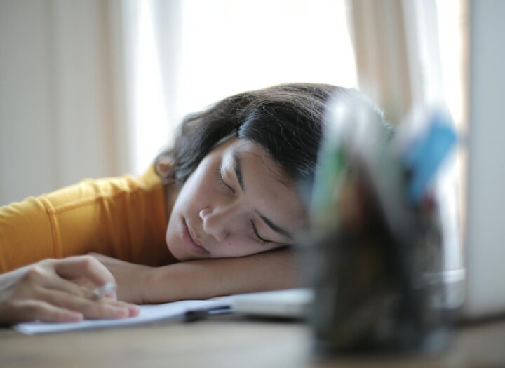 woman in yellow shirt resting on her arm